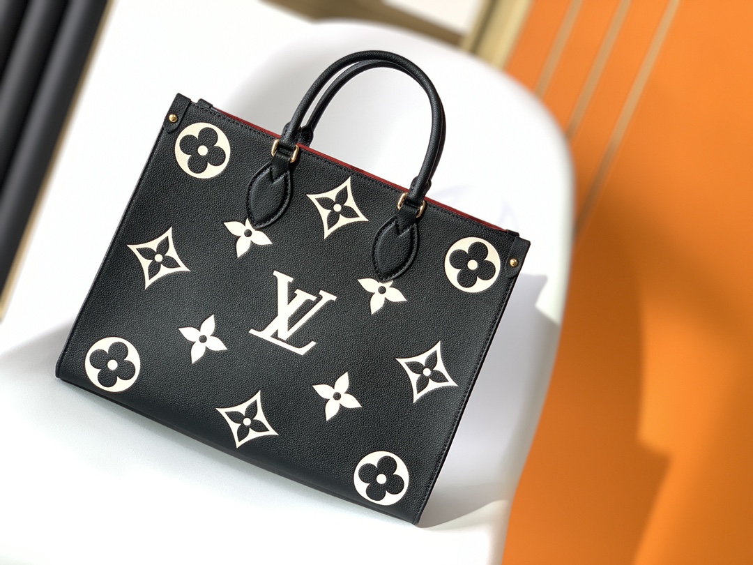 Louis Vuitton on the go handbag tote medium black and white