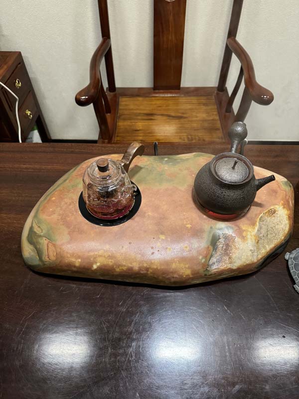 Shexian inkstone, a famous Chinese stone, is used in a hand-polished tea stove.
