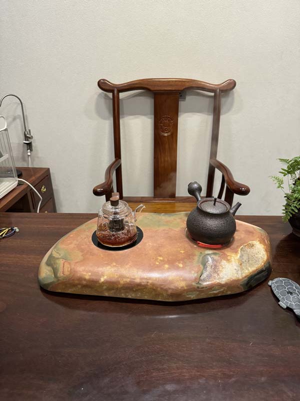 Shexian inkstone, a famous Chinese stone, is used in a hand-polished tea stove.