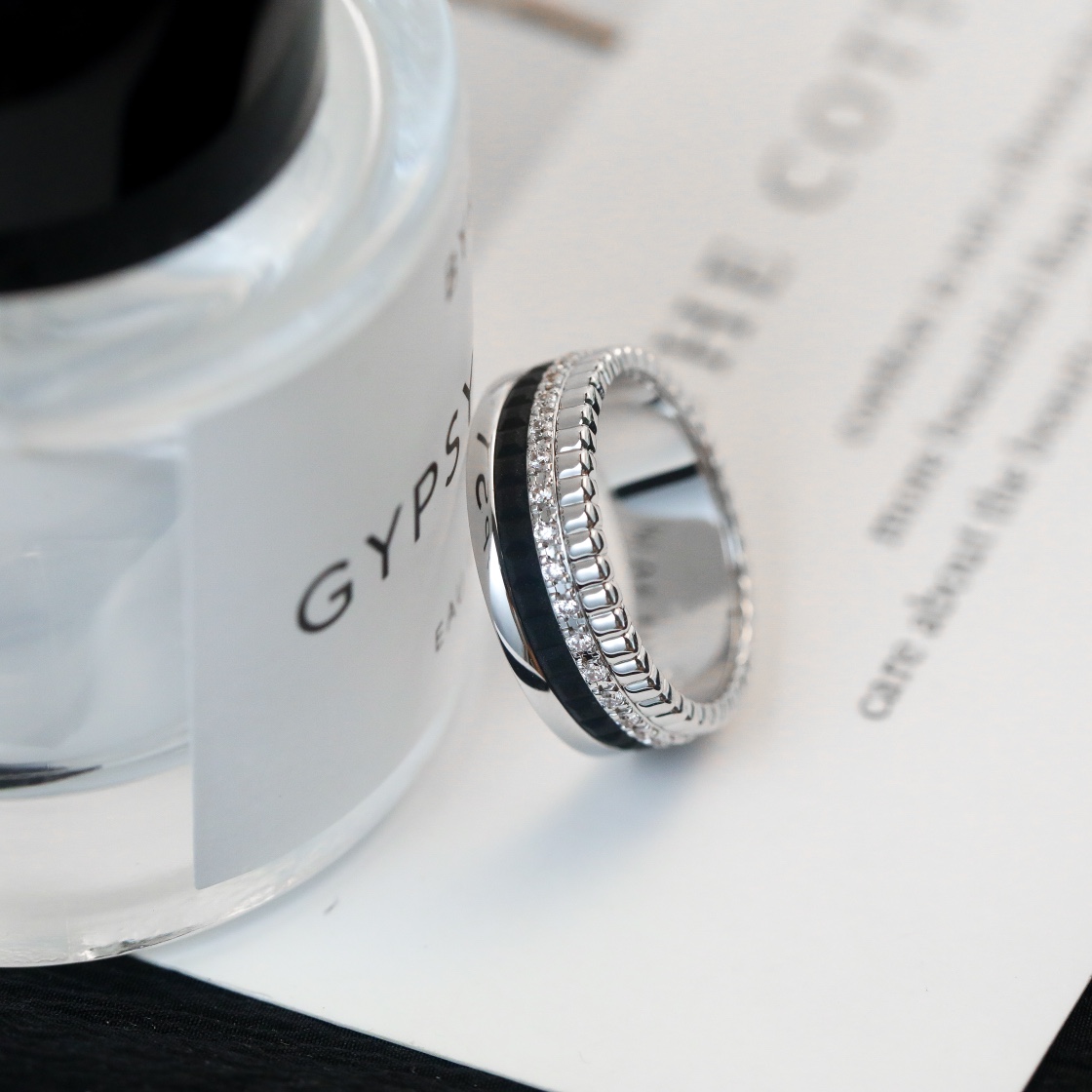 Wide diamond studded black ceramic ring