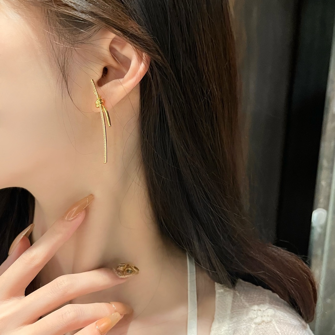 T Knot series long string earrings