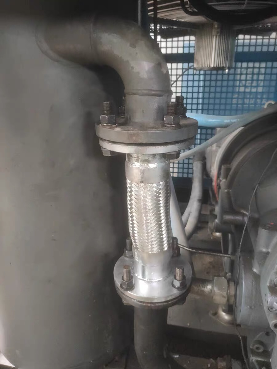 PTFE corrugated expansion joint installed on glass-lined chemical reactor flange