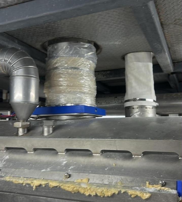 Traditional canvas flexible joint wrapped with tape showing severe dust buildup, hygiene risks, and maintenance hassle