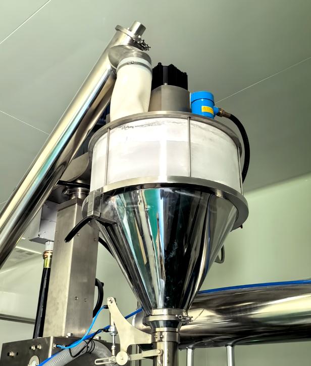Transparent FDA-grade TPU flexible sleeve isolating 3D vibration between cleanroom screener and hopper.