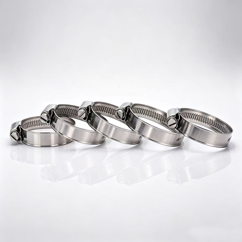 Multiple quick release sanitary hose clamps laid out for industrial pipe connections